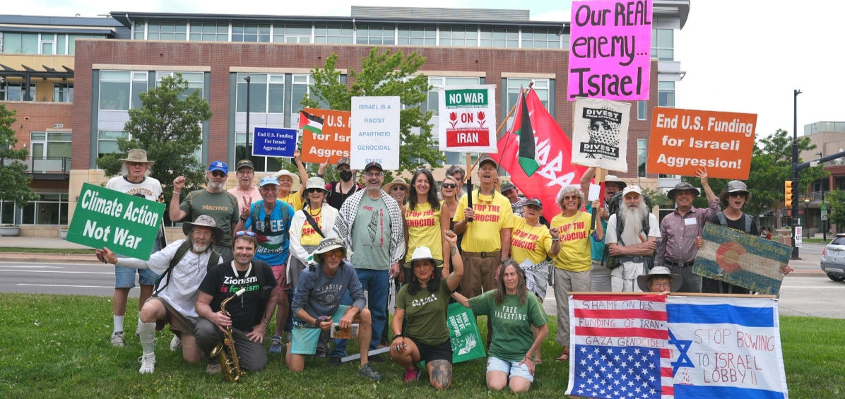 Members of First Justice Then Peace gathered at Canyon and Broadway, holding signs and Palestinian flags.